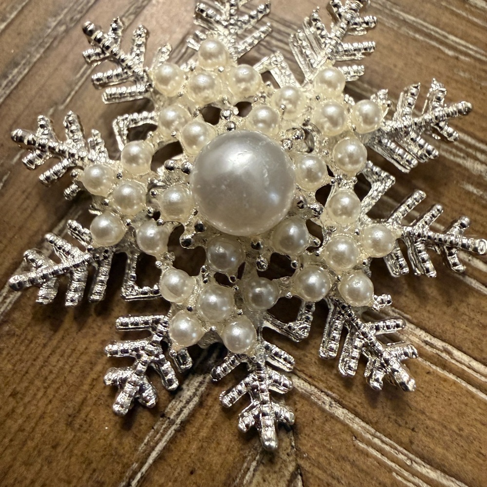 Elegant Silver and Pearl Snowflake Brooch
